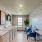 Model laundry room at Alders Magnolia 55 and over apartments, featuring wood grain flooring and a washer and dryer.
