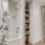 Model bathroom at our apartments for rent in Magnolia, TX, featuring wood grain floor paneling and a shower / bath combo.