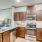 a kitchen with wooden cabinets