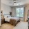 a bedroom with a large window