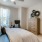 a bedroom with a bed and a fan
